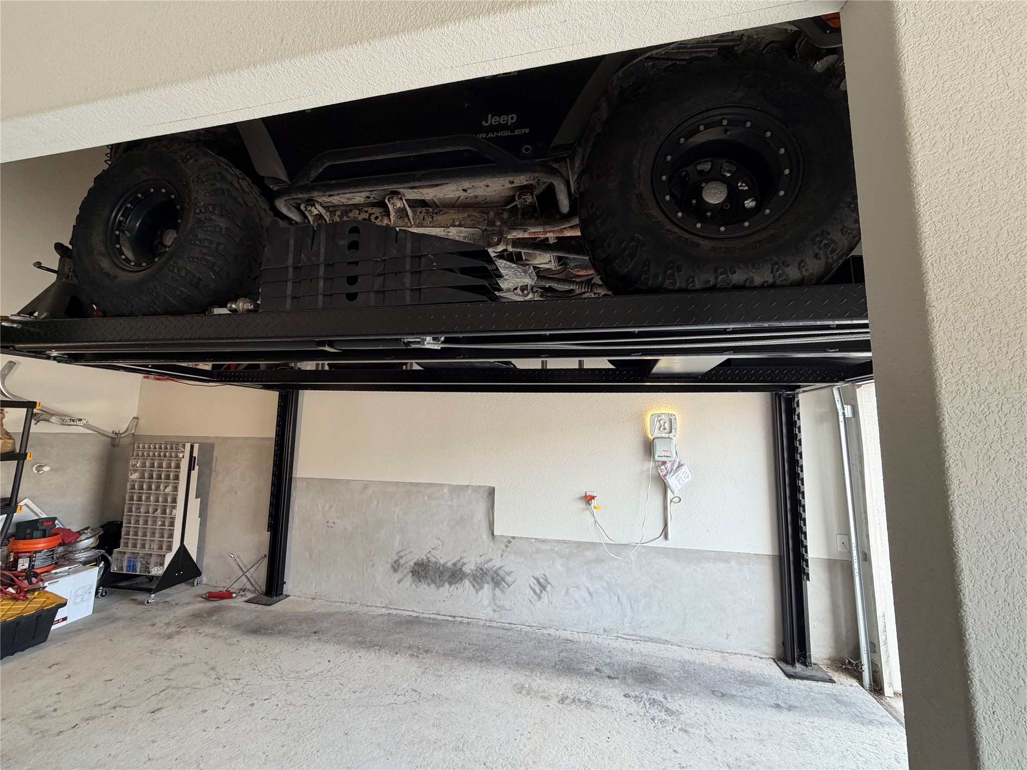 8709 Moccasin Path Austin, TX 78736 - Photo 33 of 34 Car lift for another vehicle in the garage