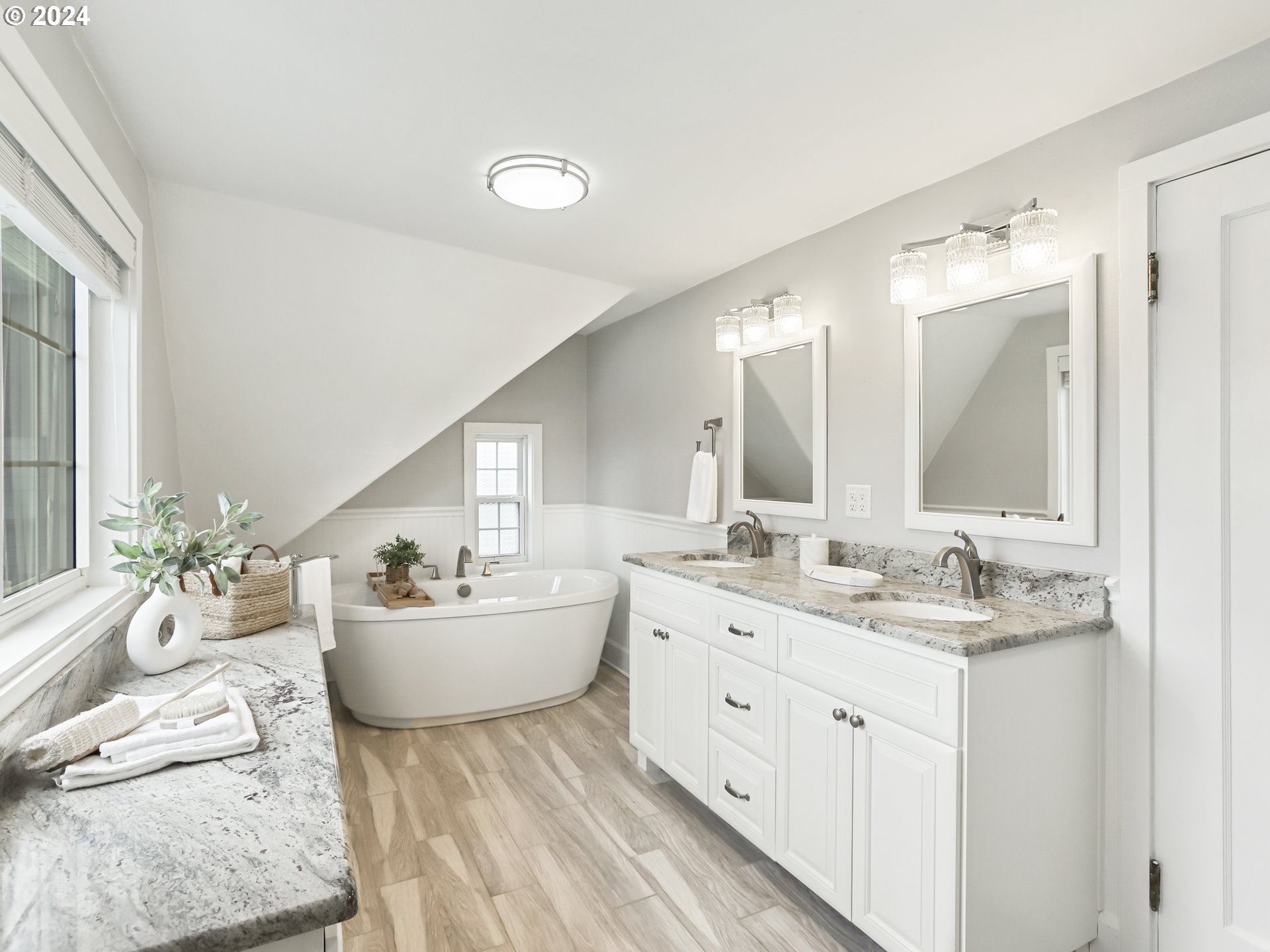 116 West 29th Street Vancouver, WA 98660 - Photo 22 of 35 a spacious bathroom with a granite countertop sink mirror and bathtub