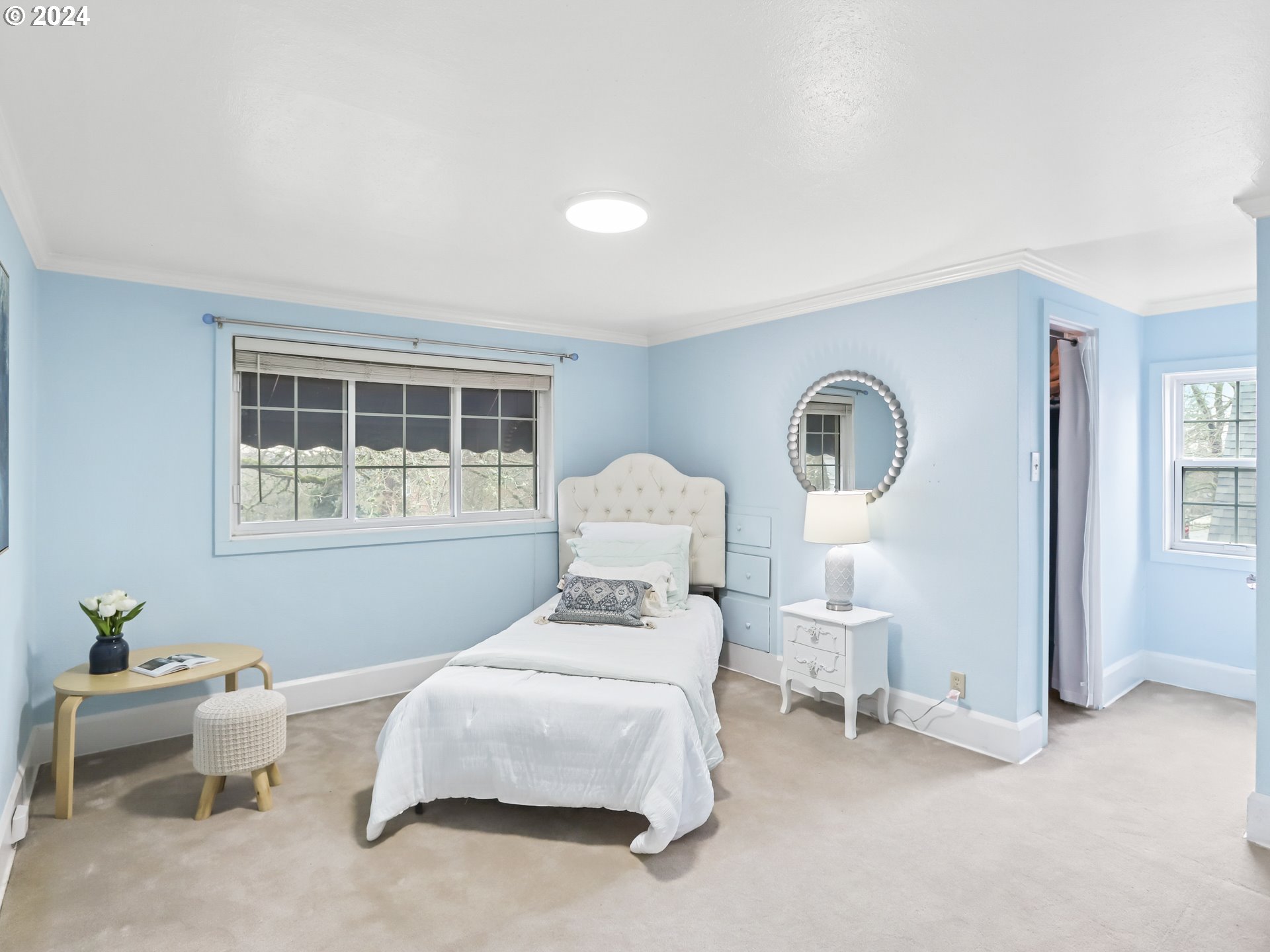 116 West 29th Street Vancouver, WA 98660 - Photo 23 of 35 a bedroom with a bed and a chair