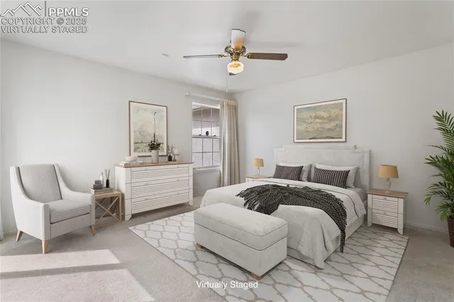 a spacious bedroom with a bed a couch and dresser