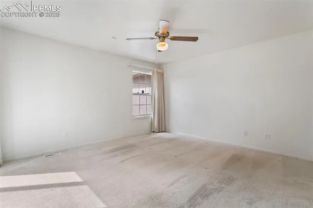 a view of a room with air conditioner and a window