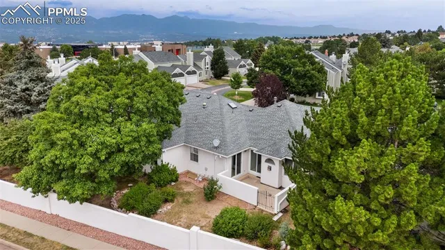 an aerial view of a house with a garden