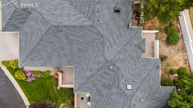 a aerial view of a house with a yard