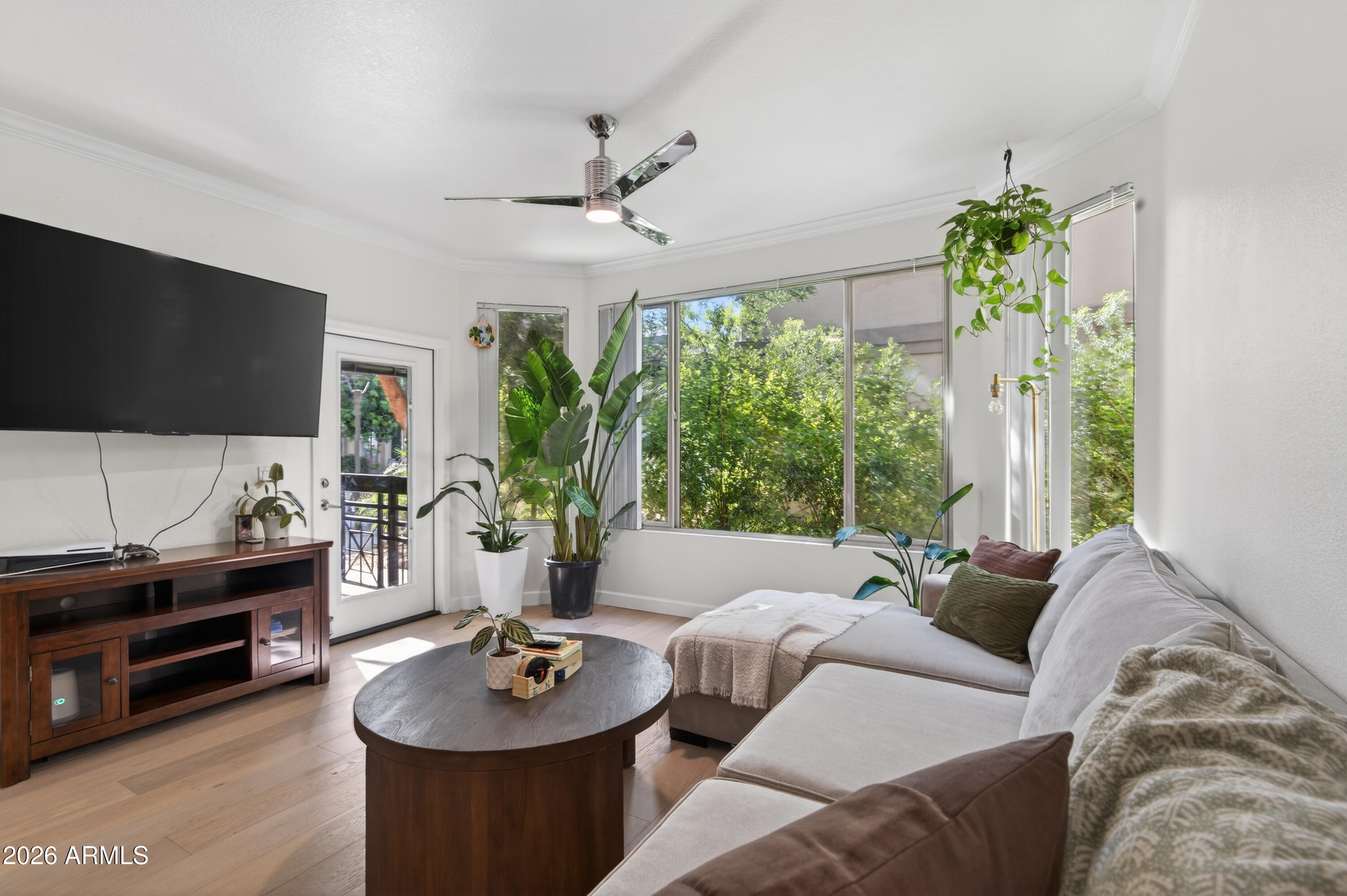 435 West Rio Salado Parkway, Unit 112 Tempe, AZ 85281 - Photo 1 of 38 a living room with furniture a window and a flat screen tv