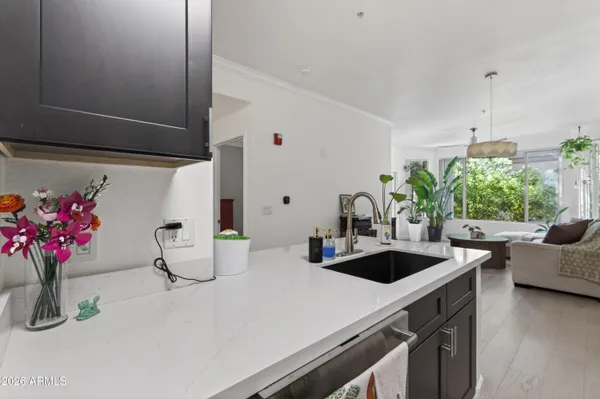 a kitchen with a sink and a stove