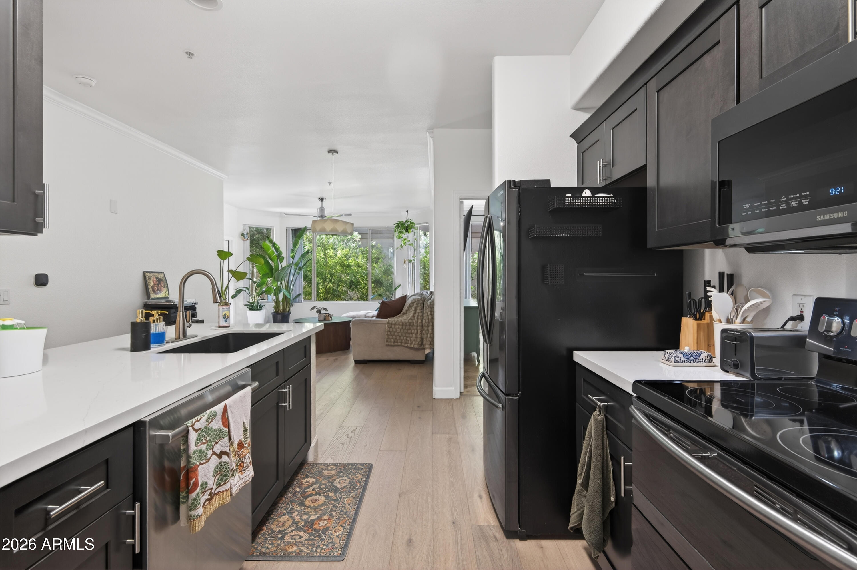 435 West Rio Salado Parkway, Unit 112 Tempe, AZ 85281 - Photo 11 of 38 a kitchen with a refrigerator and a sink