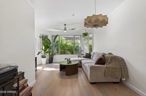 a living room with furniture and a large window