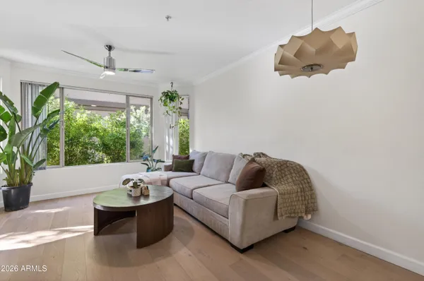 a living room with furniture and a large window