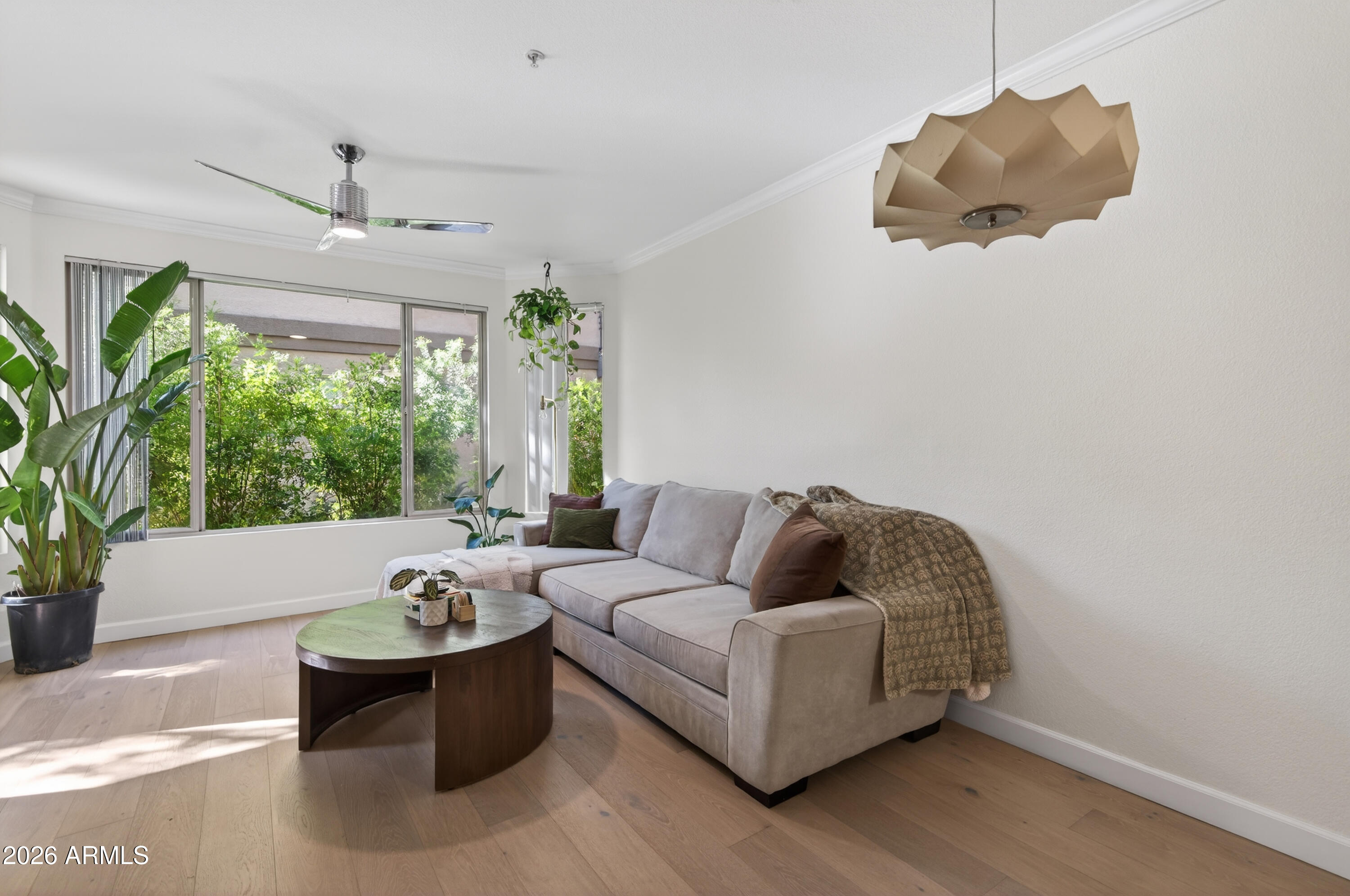 435 West Rio Salado Parkway, Unit 112 Tempe, AZ 85281 - Photo 13 of 38 a living room with furniture and a large window