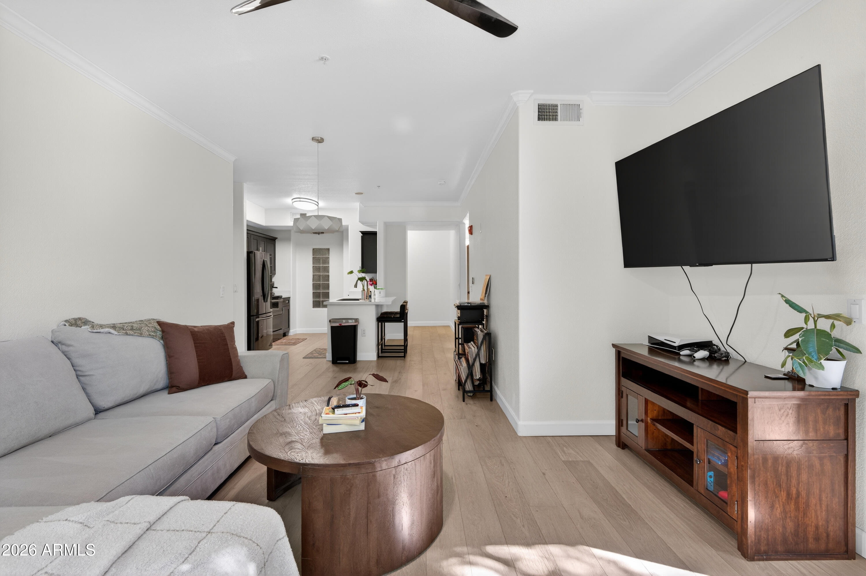 435 West Rio Salado Parkway, Unit 112 Tempe, AZ 85281 - Photo 16 of 38 a living room with furniture and a flat screen tv