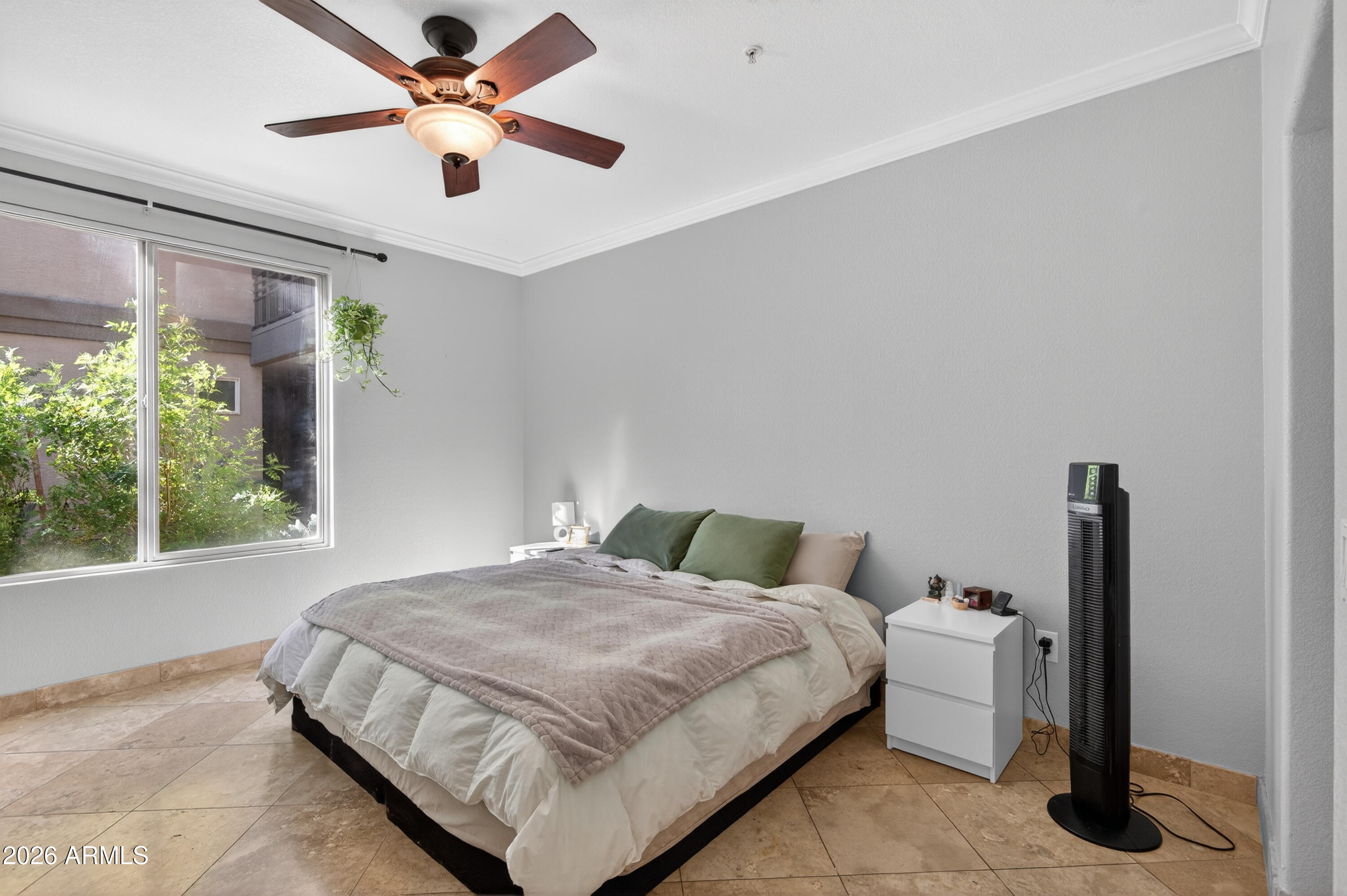 435 West Rio Salado Parkway, Unit 112 Tempe, AZ 85281 - Photo 18 of 38 a bedroom with a bed and a chandelier