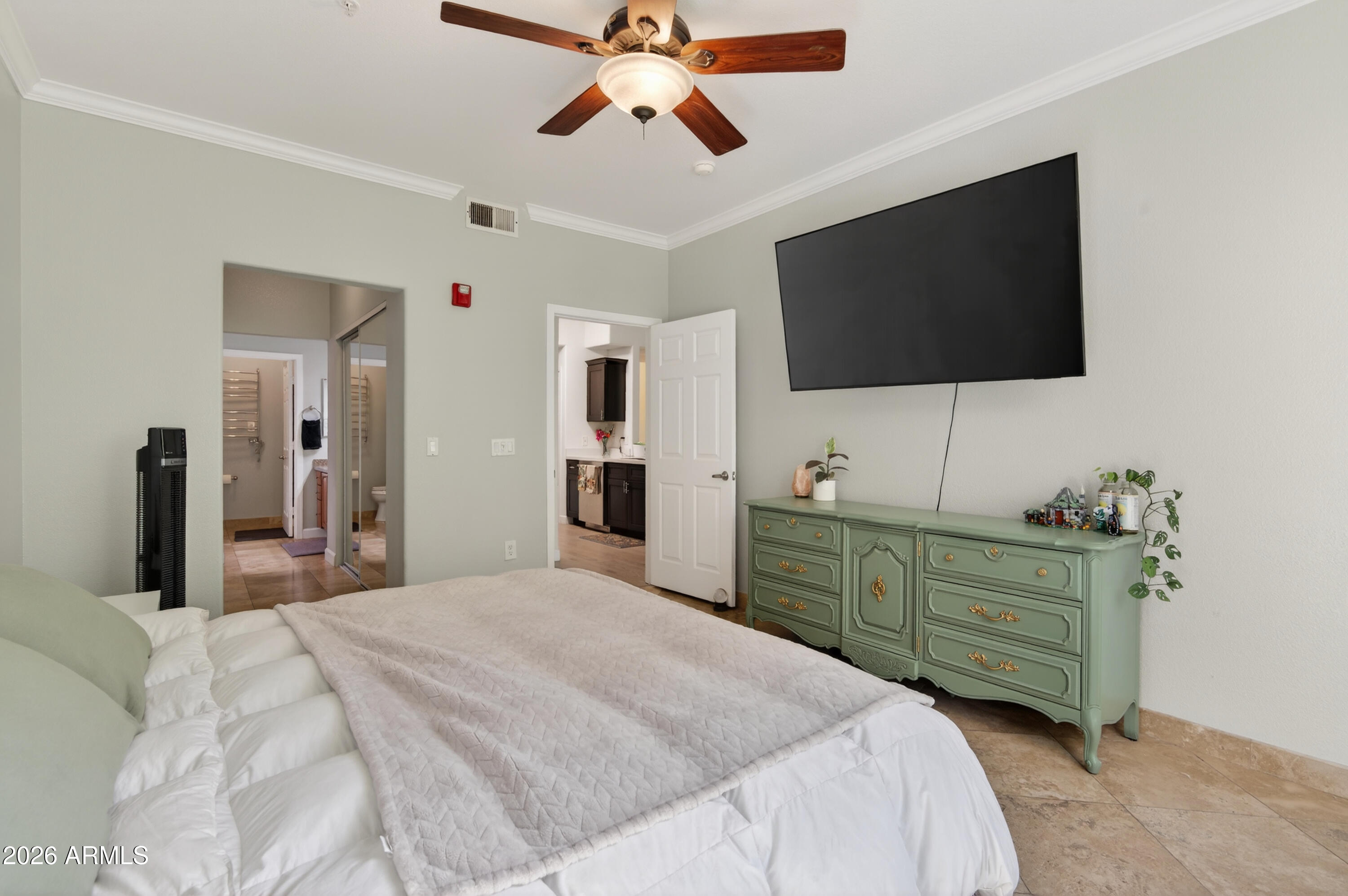 435 West Rio Salado Parkway, Unit 112 Tempe, AZ 85281 - Photo 19 of 38 a bedroom with a bed and a flat screen tv