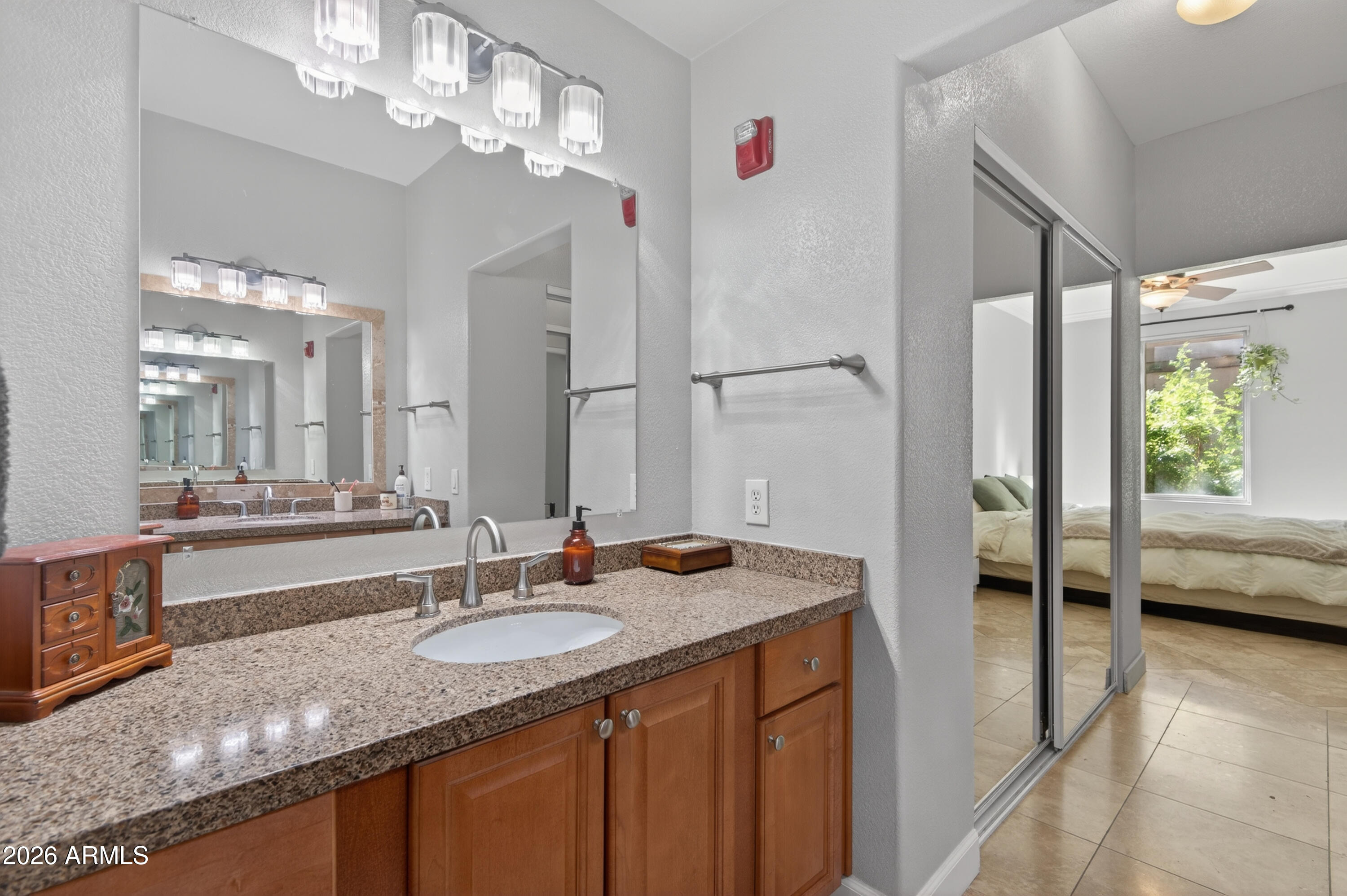 435 West Rio Salado Parkway, Unit 112 Tempe, AZ 85281 - Photo 22 of 38 a bathroom with a granite countertop sink a large mirror and a bathtub