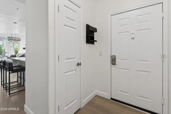 a view of a livingroom with wooden floor and closet