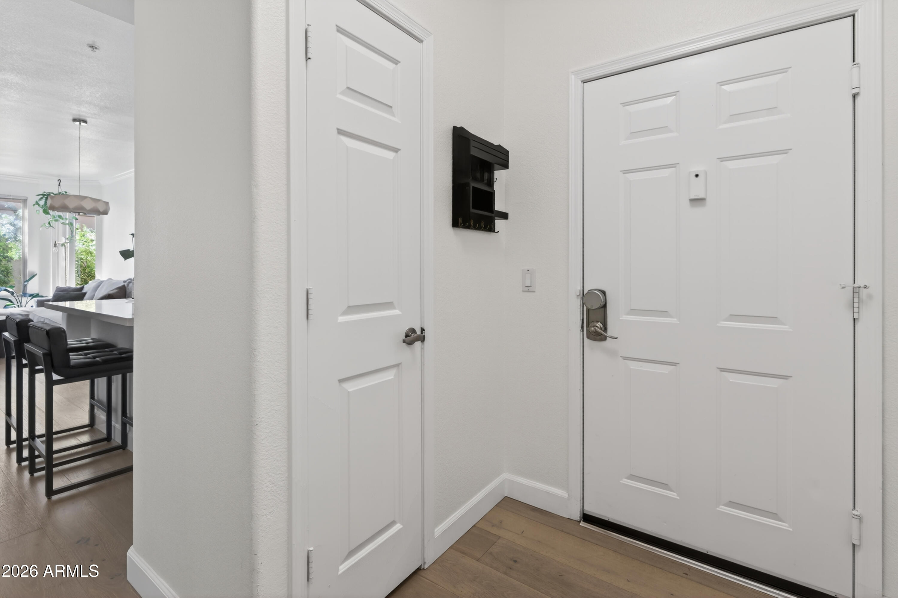 435 West Rio Salado Parkway, Unit 112 Tempe, AZ 85281 - Photo 4 of 38 a view of a livingroom with wooden floor and closet