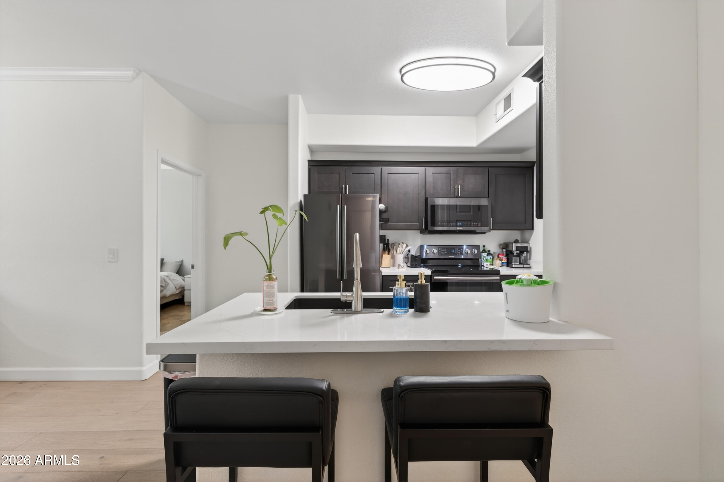 435 West Rio Salado Parkway, Unit 112 Tempe, AZ 85281 - Photo 6 of 38 a kitchen with a sink cabinets and stainless steel appliances