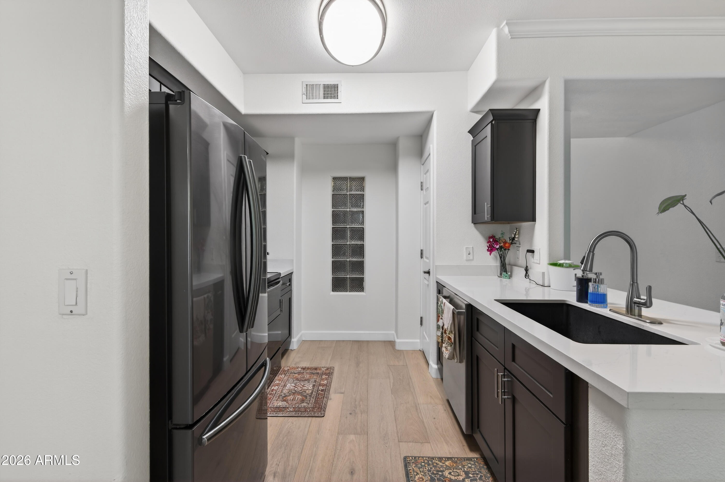 435 West Rio Salado Parkway, Unit 112 Tempe, AZ 85281 - Photo 8 of 38 a kitchen with granite countertop a sink stove and refrigerator