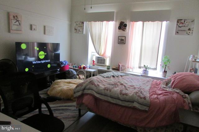 222 Baltimore Street Hanover, PA 17331 - Photo 12 of 18 a bedroom with a bed table chair and a window