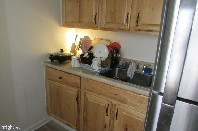 222 Baltimore Street Hanover, PA 17331 - Photo 13 of 18 a room with a refrigerator and cabinets