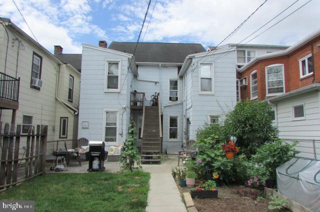 222 Baltimore Street Hanover, PA 17331 - Photo 4 of 18 a view of a building with a garden and sitting area