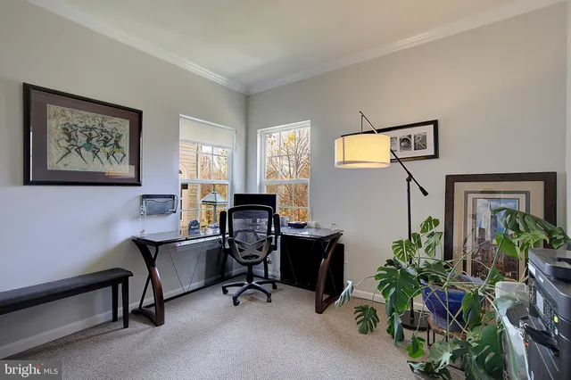 a kitchen with a dining table and chairs
