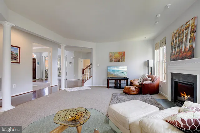 a spacious bathroom with a double vanity sink a large mirror and a shower