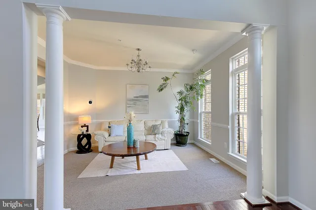 a living room with furniture and a piano