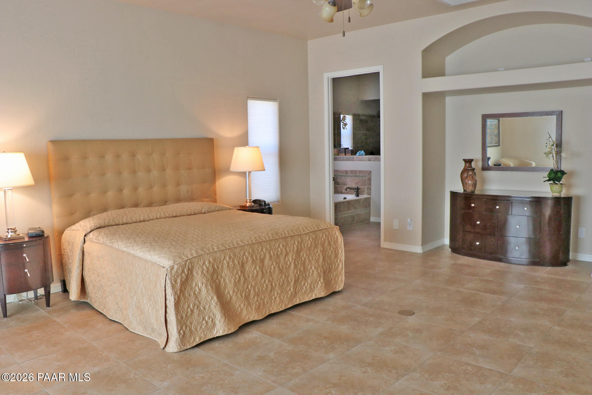 7051 Dillon Wash Road Prescott, AZ 86305 - Photo 13 of 31 a spacious bedroom with a bed and a view of bathroom