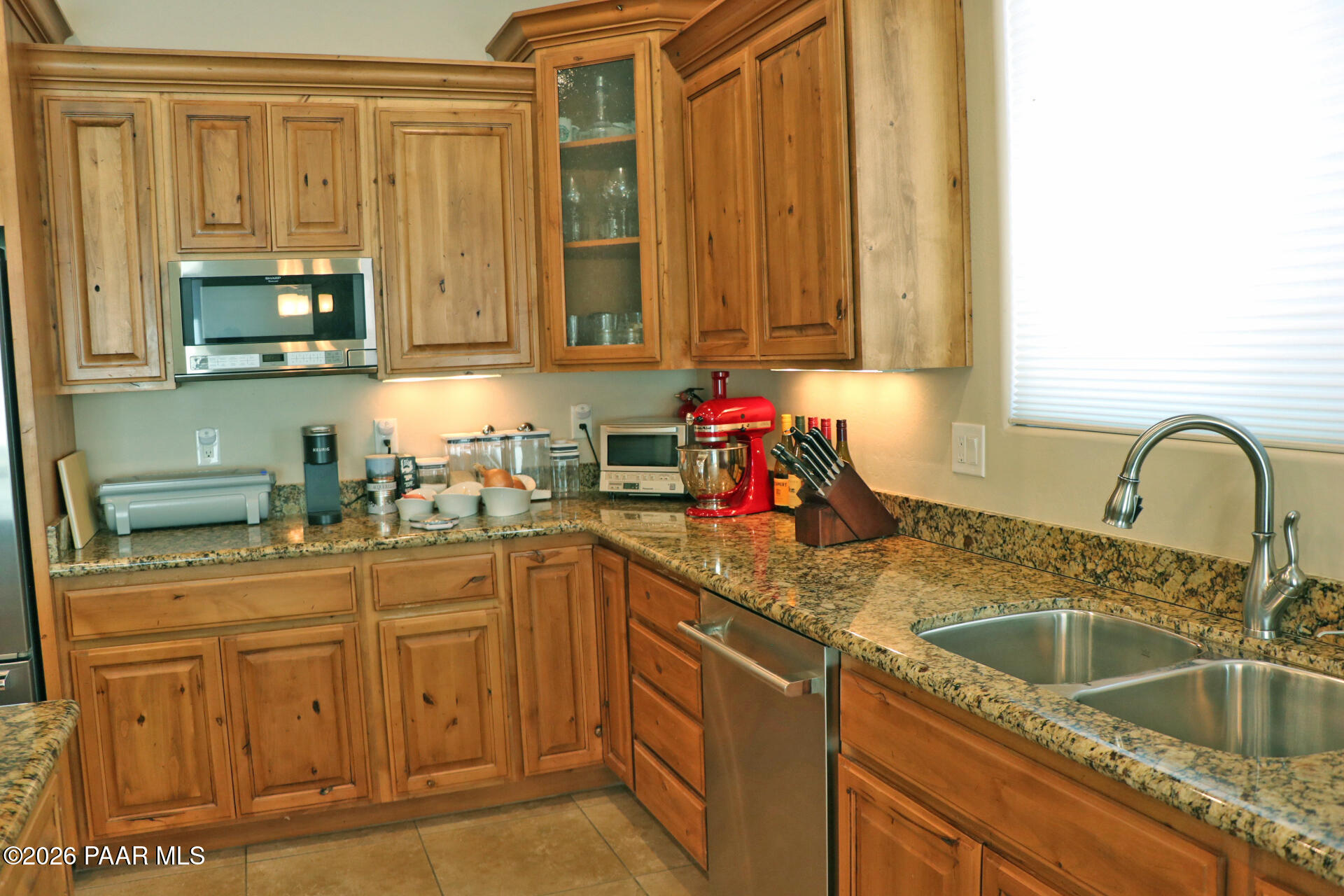7051 Dillon Wash Road Prescott, AZ 86305 - Photo 23 of 31 a kitchen with stainless steel appliances granite countertop a sink a stove and cabinets