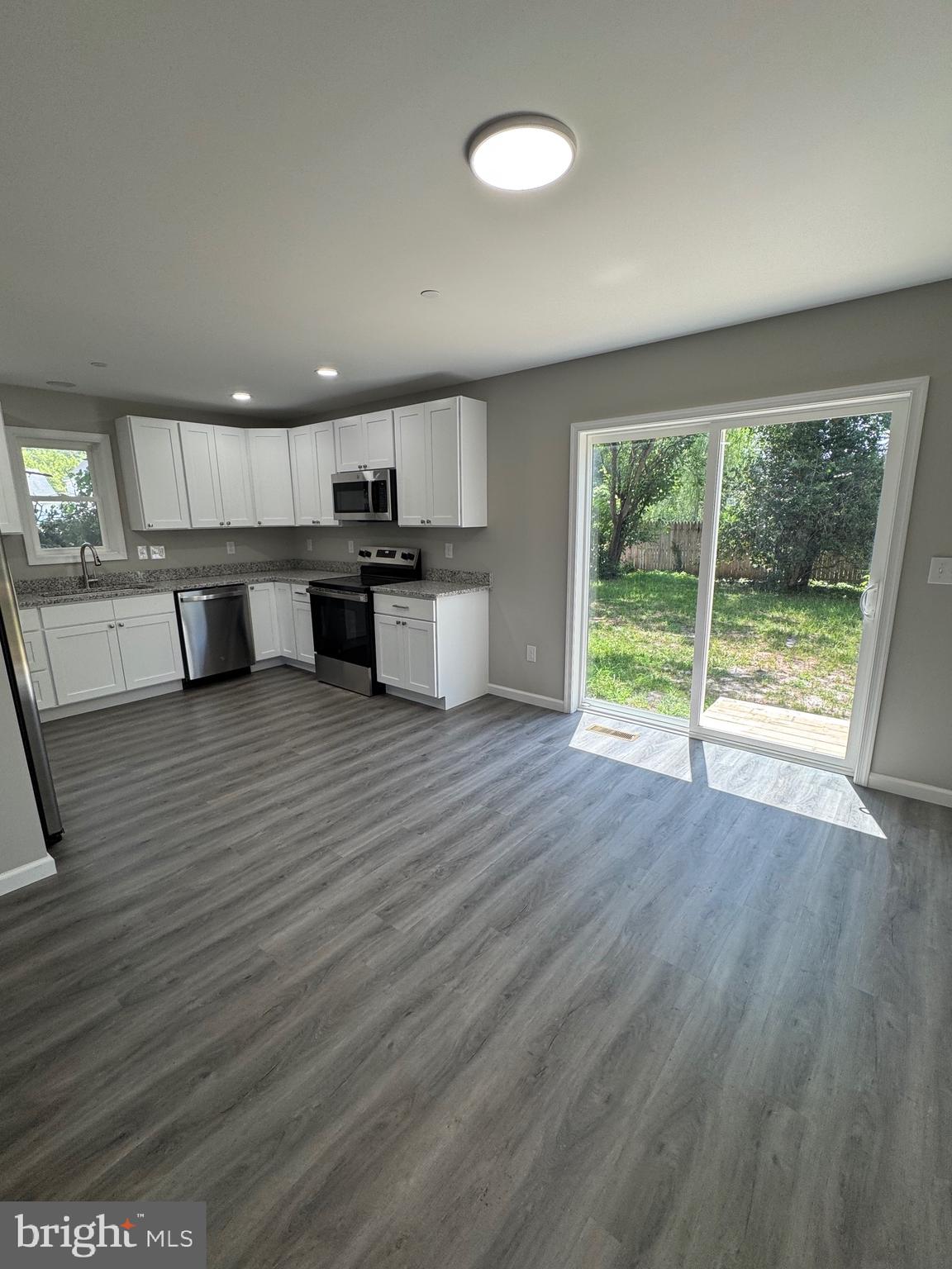 210 West 2nd Street Ridgely, MD 21660 - Photo 10 of 36 a view of kitchen with wooden floor and electronic appliances