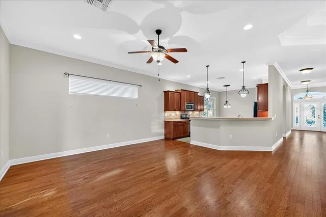 a view of a kitchen with a stove cabinets and wooden floor