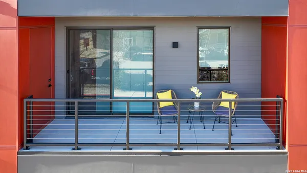 a view of balcony with wooden floor