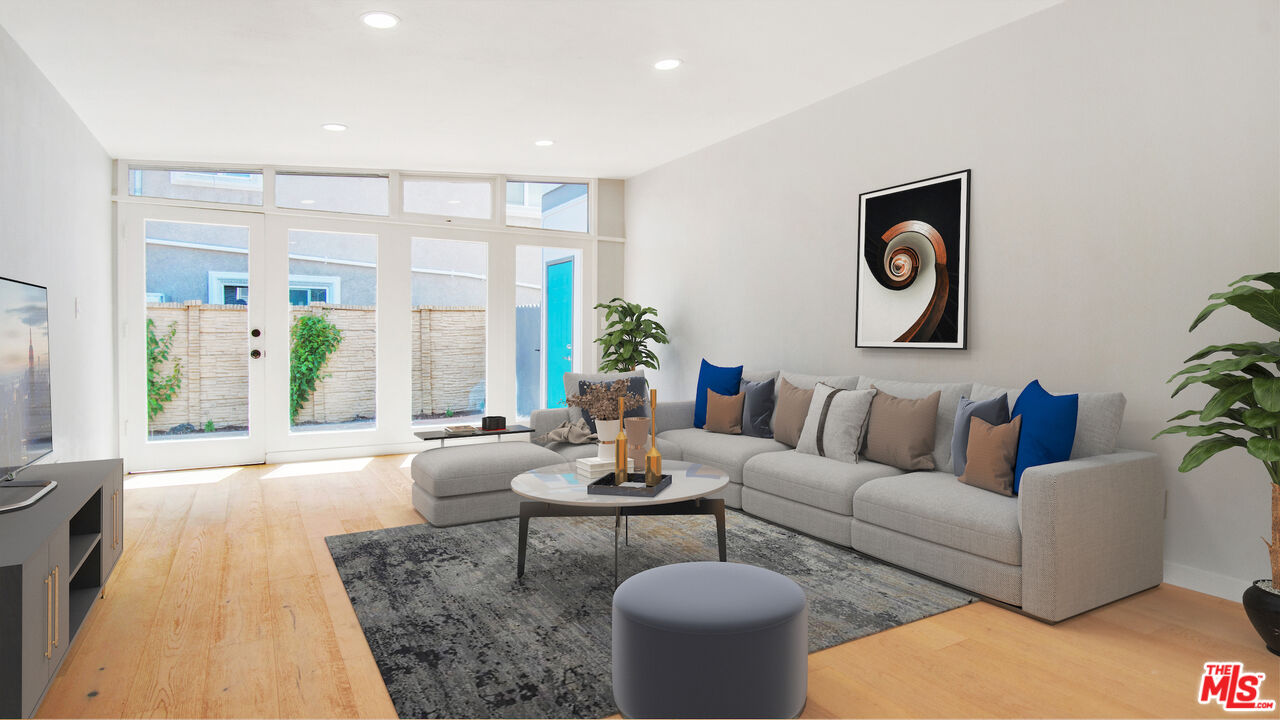 1610 East Carson Street, Unit 3 Long Beach, CA 90807 - Photo 1 of 21 a living room with furniture and a large window
