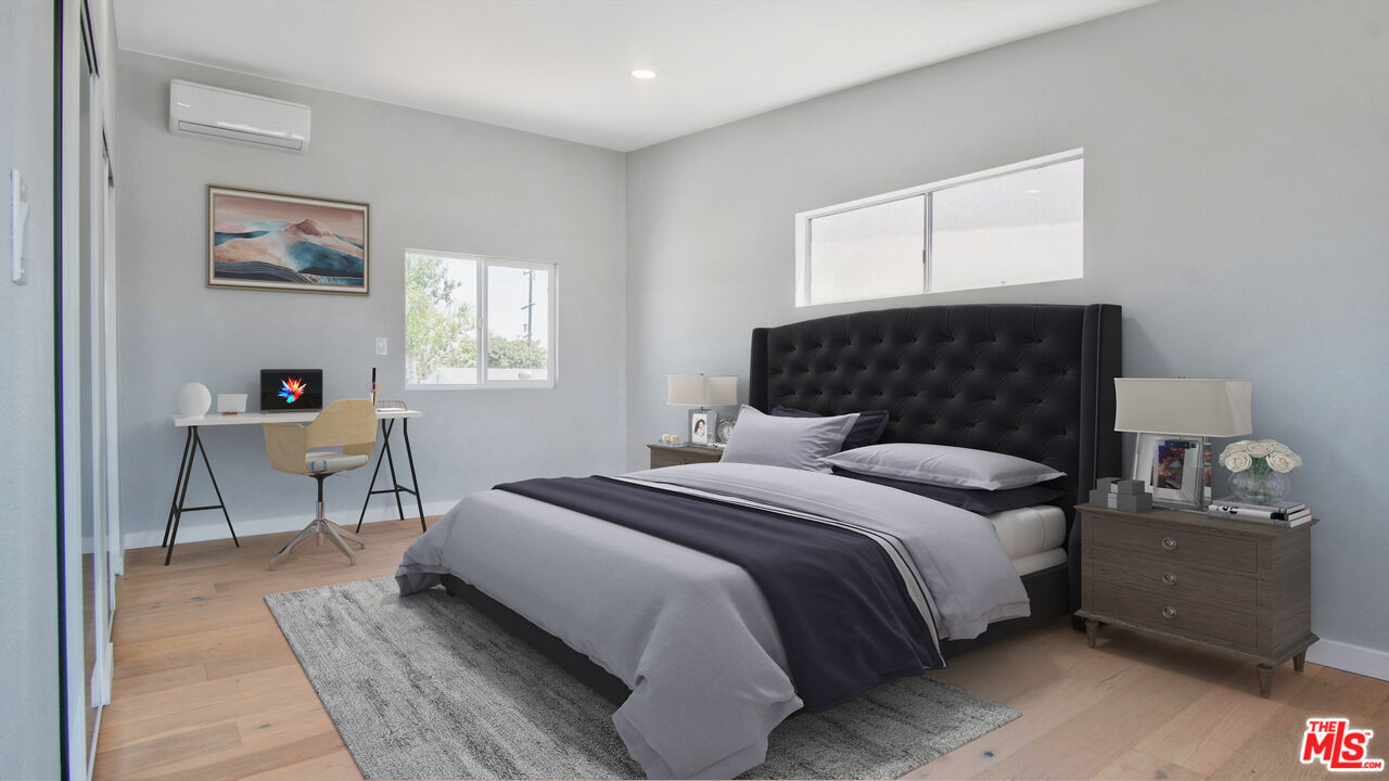 1610 East Carson Street, Unit 3 Long Beach, CA 90807 - Photo 12 of 21 a bedroom with a bed and a table in it