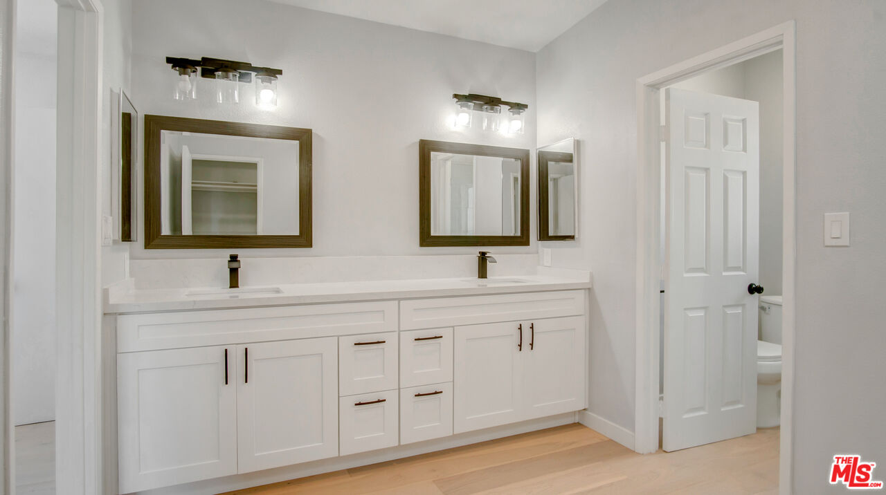 1610 East Carson Street, Unit 3 Long Beach, CA 90807 - Photo 14 of 21 a bathroom with double sink and a mirror