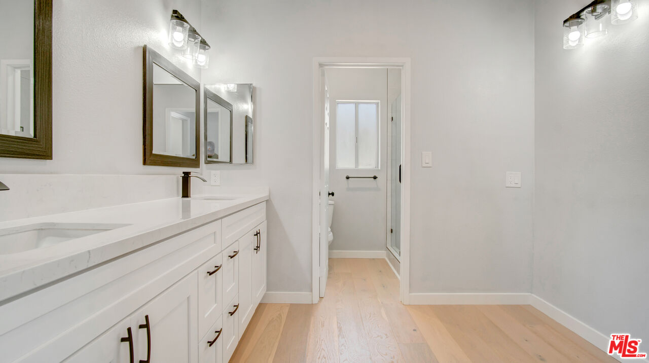 1610 East Carson Street, Unit 3 Long Beach, CA 90807 - Photo 15 of 21 a spacious bathroom with a double vanity sink a mirror and a shower