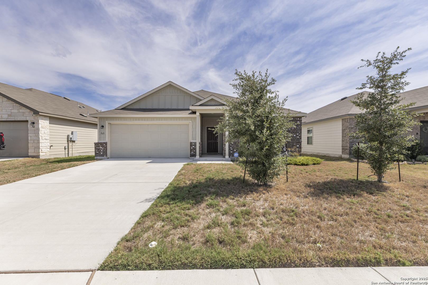 765 Stonemanor Bay Seguin, TX 78155 - Photo 1 of 29 a front view of a house with garden