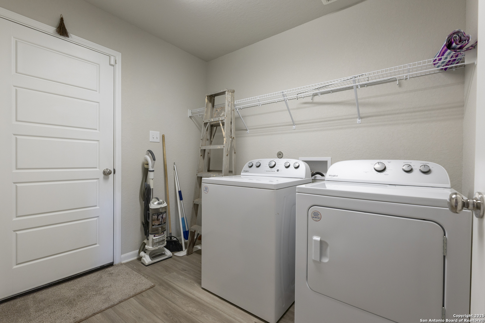 765 Stonemanor Bay Seguin, TX 78155 - Photo 21 of 29 a utility room with dryer and washer