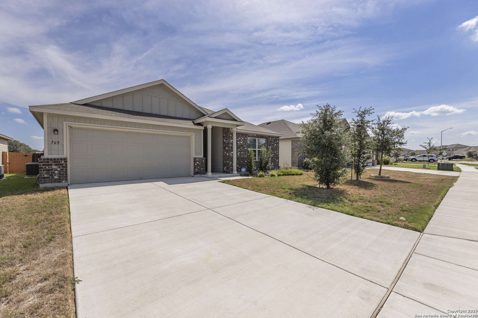 765 Stonemanor Bay Seguin, TX 78155 - Photo 28 of 29 a front view of a house with a yard