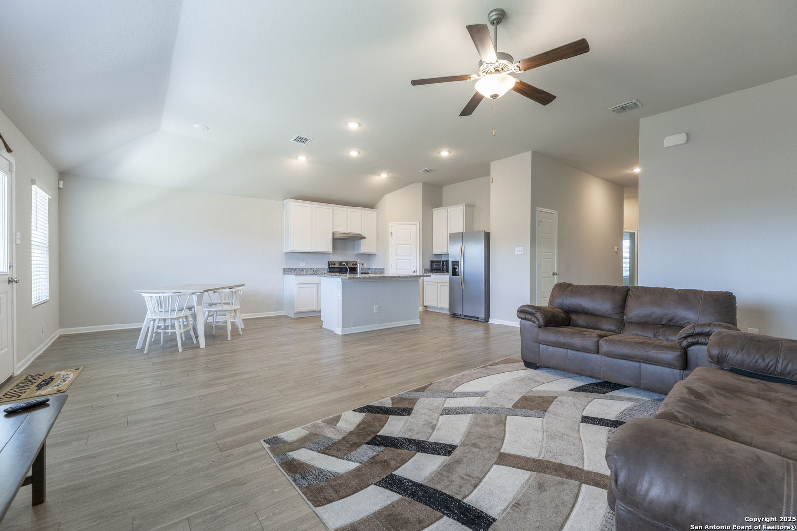 765 Stonemanor Bay Seguin, TX 78155 - Photo 3 of 29 a living room with furniture and kitchen view