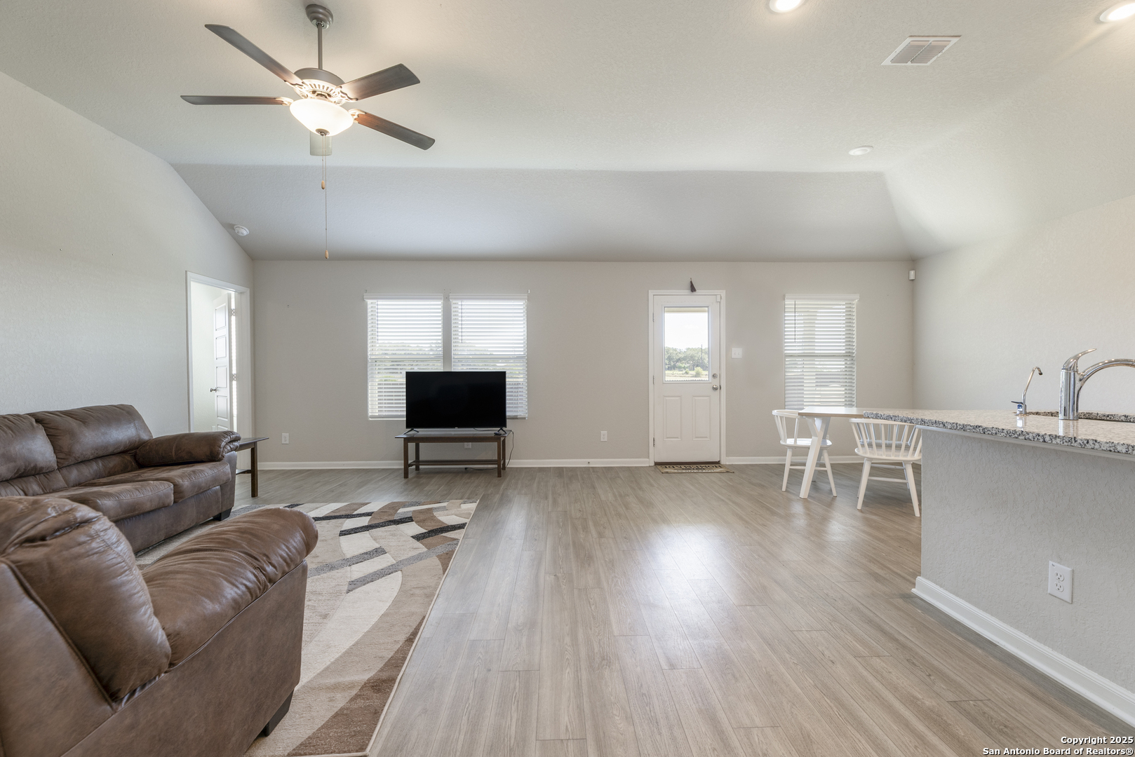 765 Stonemanor Bay Seguin, TX 78155 - Photo 6 of 29 a living room with furniture and a wooden floor