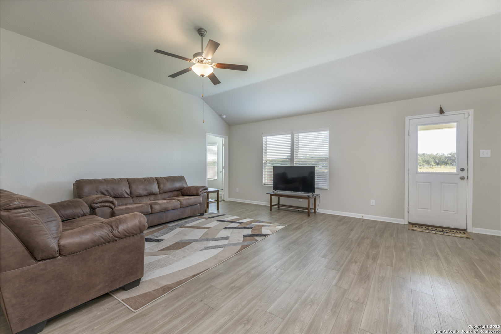 765 Stonemanor Bay Seguin, TX 78155 - Photo 8 of 29 a living room with furniture and a wooden floor