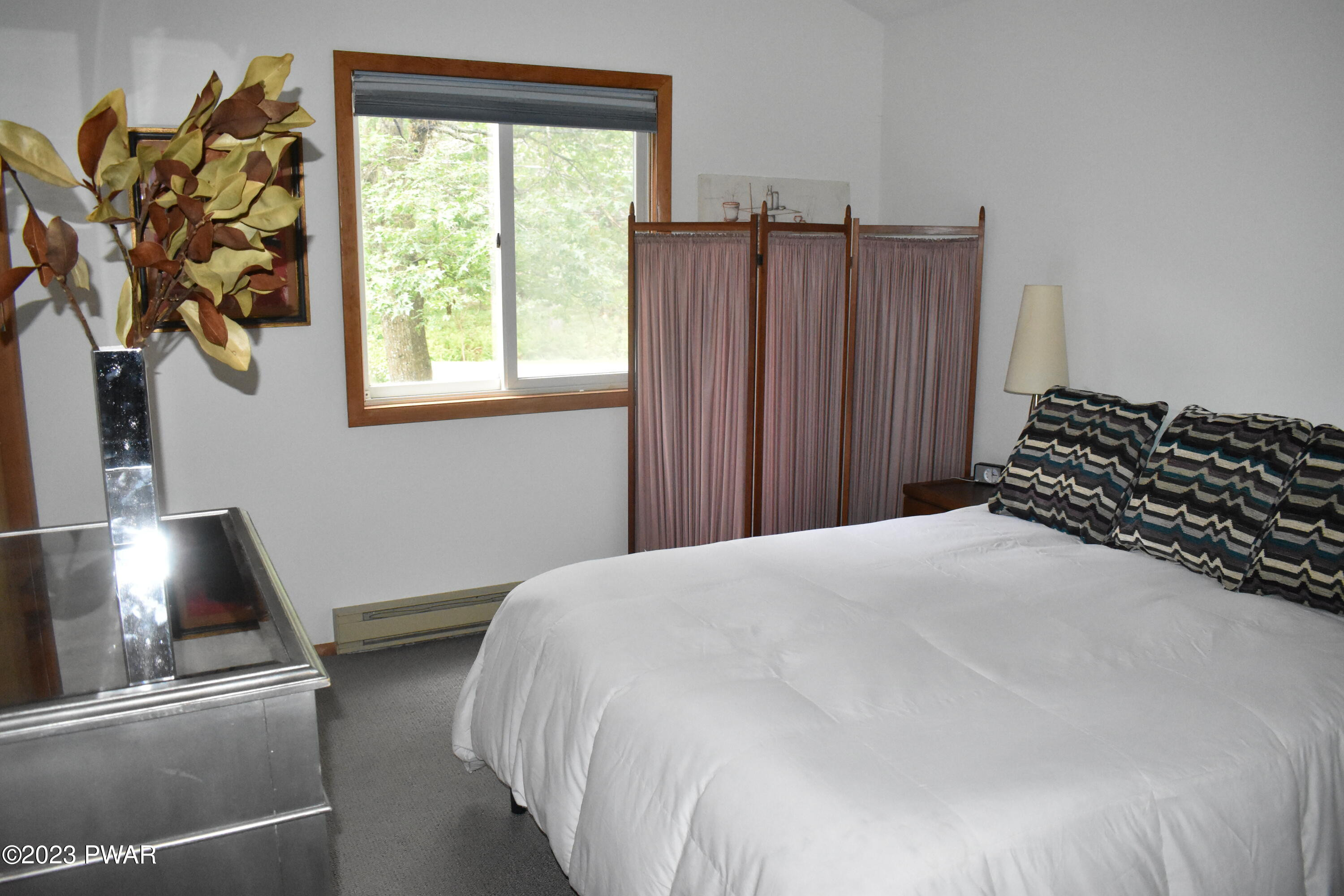 139 Rodeo Drive Hawley, PA 18428 - Photo 21 of 27 a bedroom with a bed and a window