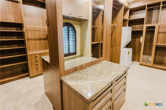 a kitchen with stainless steel appliances granite countertop a refrigerator stove and sink