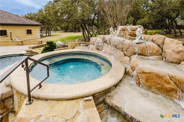 a view of a swimming pool with a patio