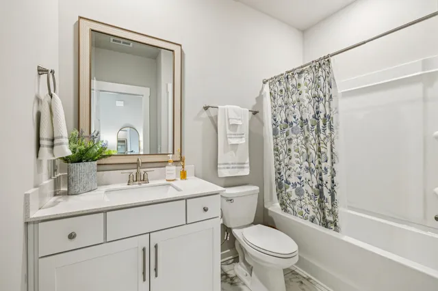 a view of storage and utility room with washer and dryer