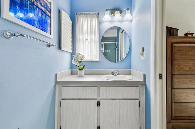 an aerial view of residential houses with outdoor space and river