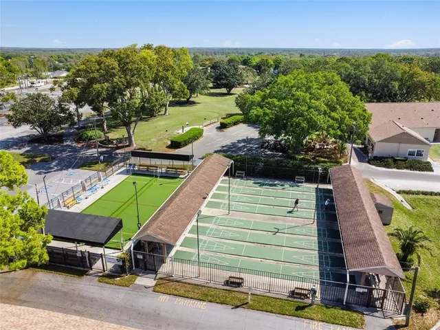 an aerial view of a house with outdoor space