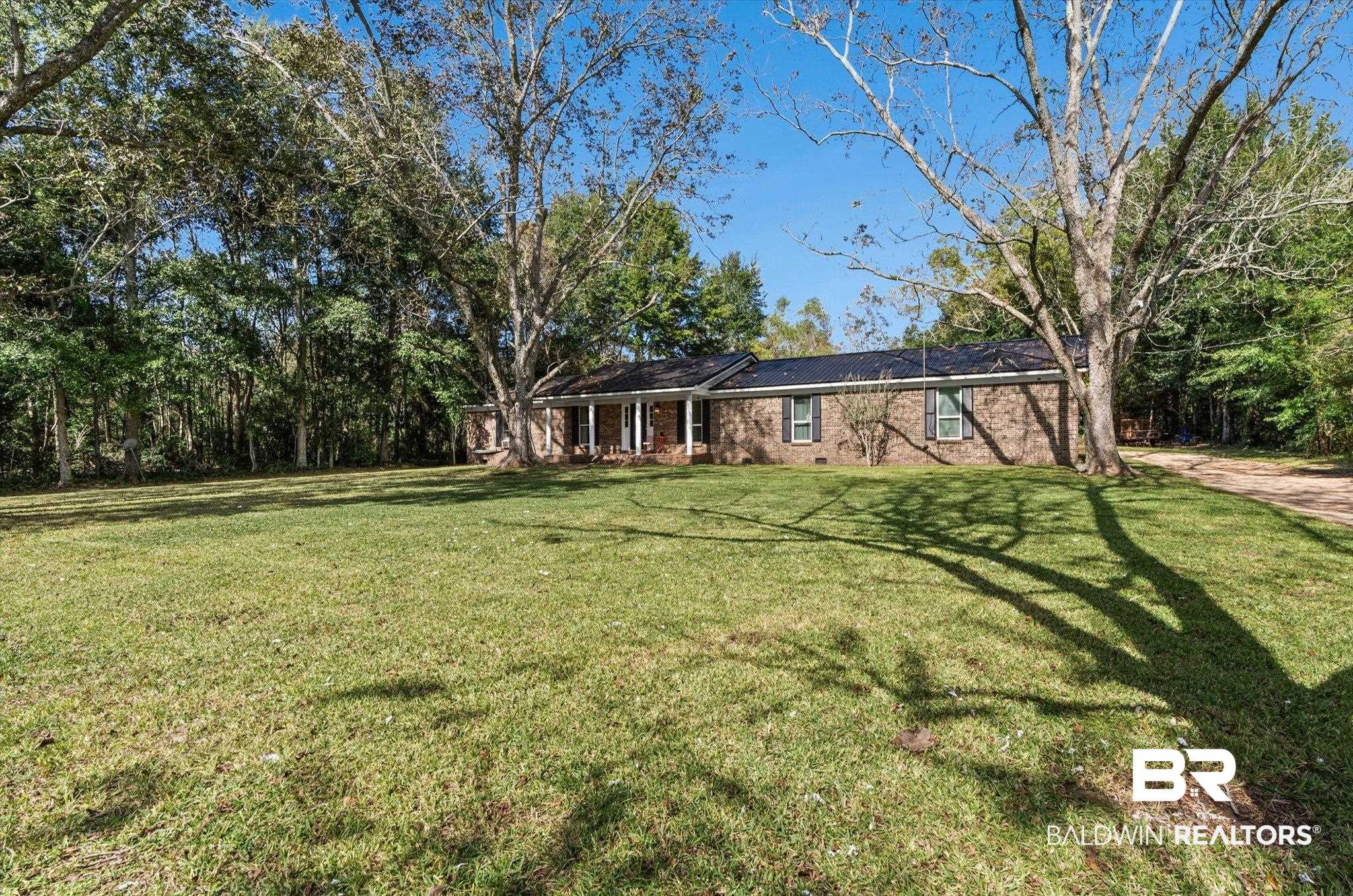 11440 Diffee Road Grand Bay, AL 36541 - Photo 3 of 22 View of front facade featuring a front lawn and brick siding