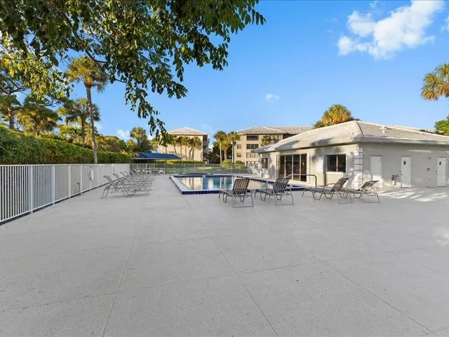 a view of a park with big trees